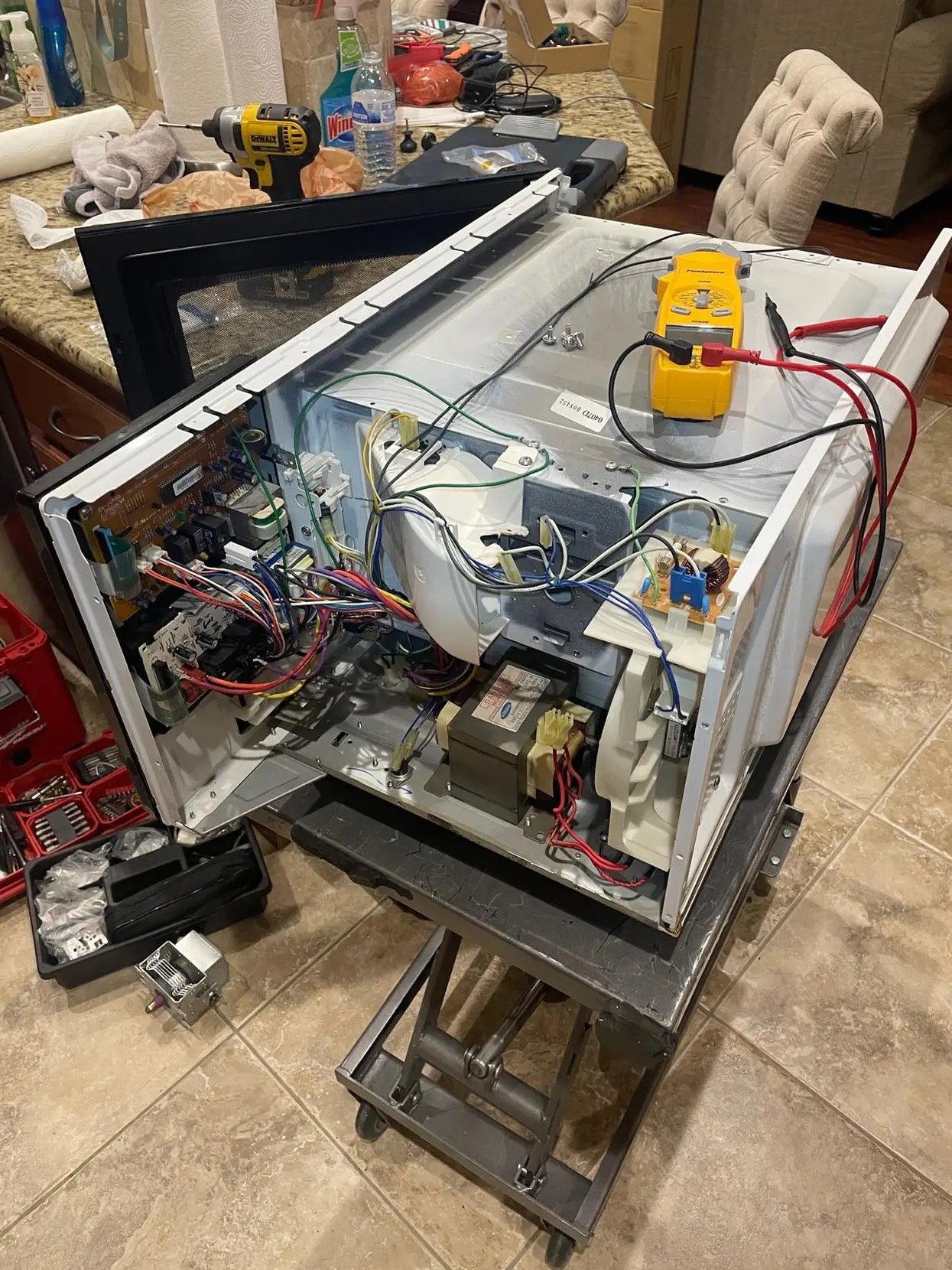 Microwave repair with multimeter.
